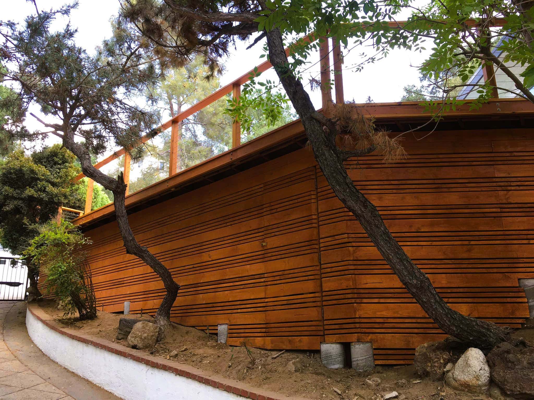 Beautiful wooden deck with railing, built with natural materials in Los Angeles.